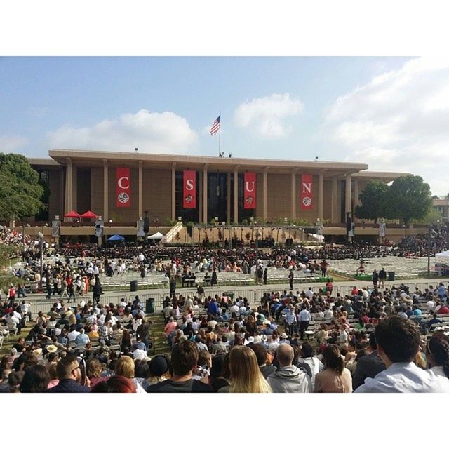 large group of people, crowd, transfer print, men, person, lifestyles, leisure activity, mixed age range, auto post production filter, building exterior, architecture, built structure, spectator, celebration, togetherness, sky, city life, crowded, flag