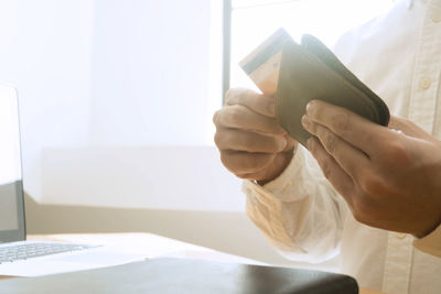 Midsection of woman working on table