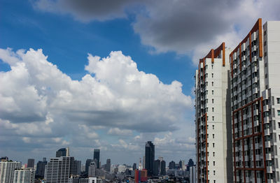 Buildings in city against sky