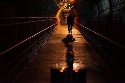 Blurred motion of woman in tunnel