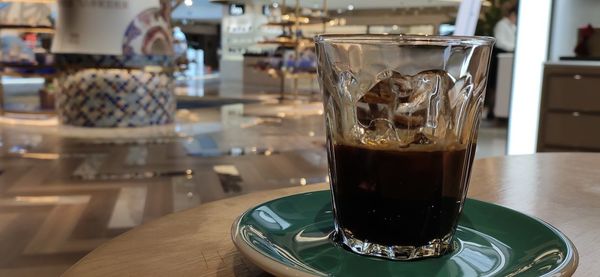 Close-up of coffee served on table