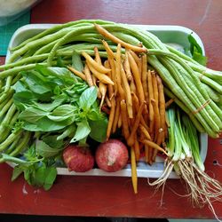 High angle view of vegetables in basket on table