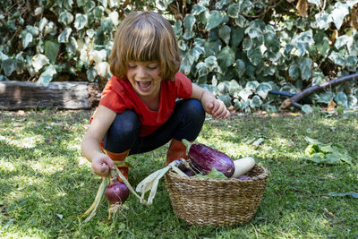 Happy boy with basket of plants