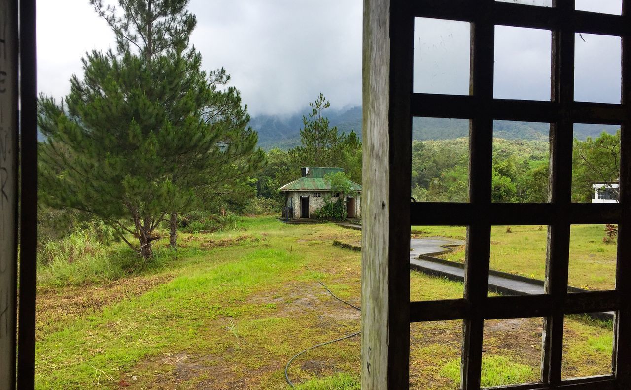 ABANDONED BUILDING ON FIELD