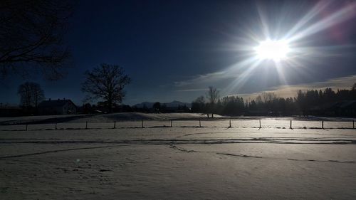 Scenic view of landscape against sky during winter