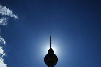 High section of tower against clear blue sky