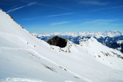 Low angle view of snowcapped mountain against sky