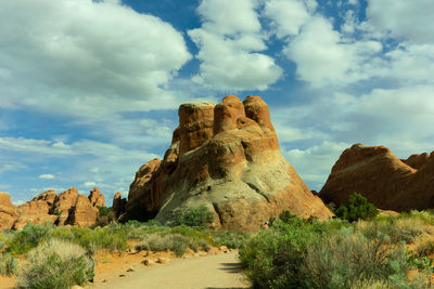 Low angle view of rock formations against sky