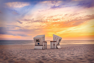 Scenic view of beach against sky during sunset