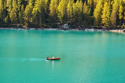 Scenic view of lake against trees. boat on a lake.