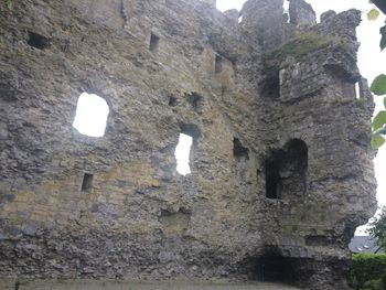 Low angle view of old ruins against sky