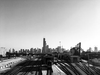 Train in city against clear sky