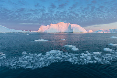 Scenic view of frozen sea against sky