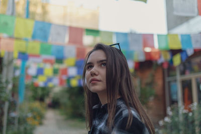 Beautiful young woman looking away