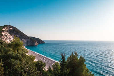 Scenic view of sea against clear blue sky