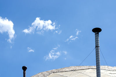 Low angle view of communications tower against sky