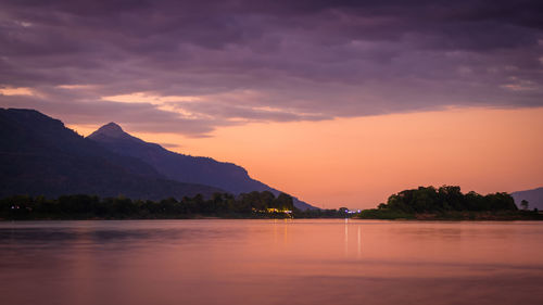 Scenic view of lake against sky during sunset