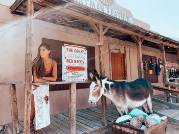 Portrait of woman against built structure