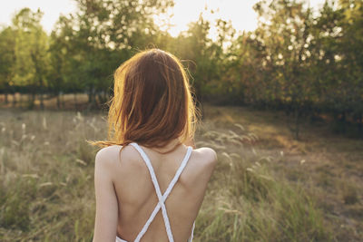 Rear view of woman with umbrella
