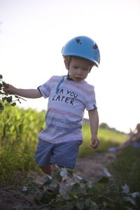 Boy standing on field