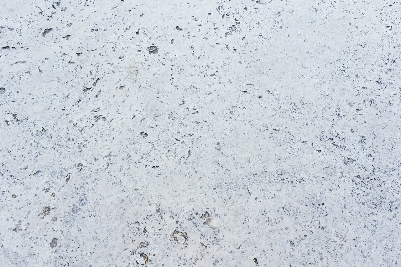 FULL FRAME SHOT OF CONCRETE ON FLOOR AGAINST SKY