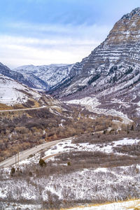 Scenic view of snowcapped mountains against sky