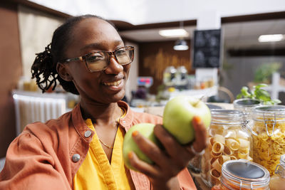 Portrait of young woman sitting at restaurant