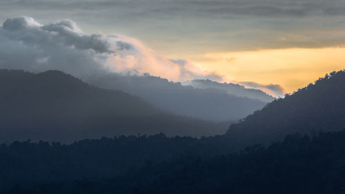 Scenic view of silhouette mountains against sky during sunset