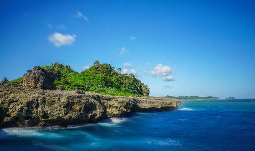 Scenic view of sea against blue sky