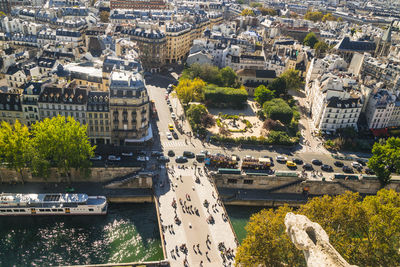  view on paris from roof of notre dame cathedral on bright sunny day