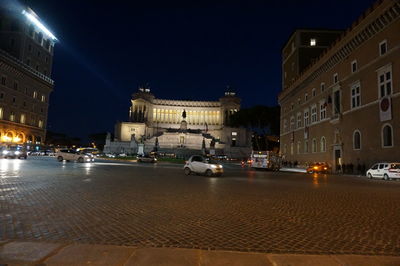 Illuminated buildings in city at night