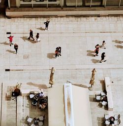 High angle view of people on building wall