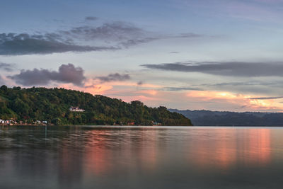 Scenic view of lake against sky during sunset