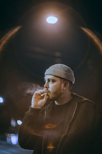 Portrait of young man looking away