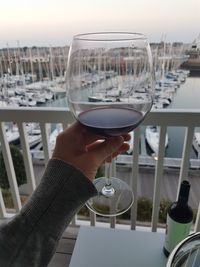 Close-up of hand holding wine glass