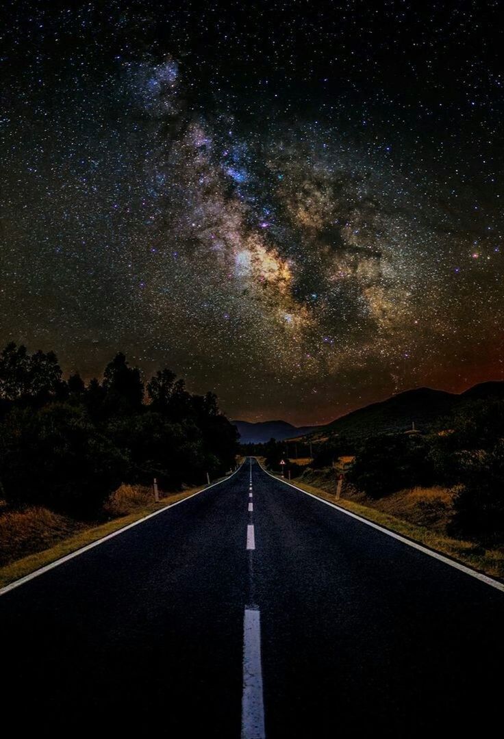 road, the way forward, direction, sky, transportation, vanishing point, diminishing perspective, space, road marking, no people, marking, symbol, star - space, night, sign, nature, astronomy, beauty in nature, tranquility, scenics - nature, outdoors, milky way, dividing line