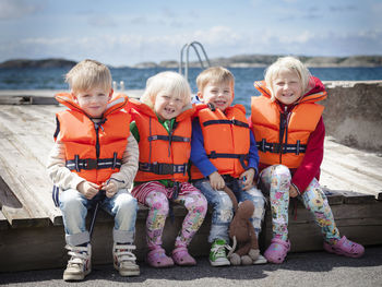 Smiling children in life jackets