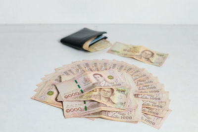 High angle view of paper currency on table