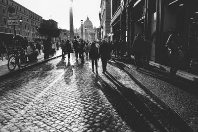 People walking on road in city