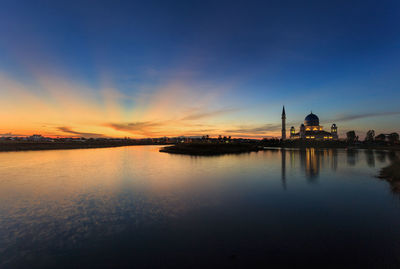 Panoramic view of buildings against sky during sunset
