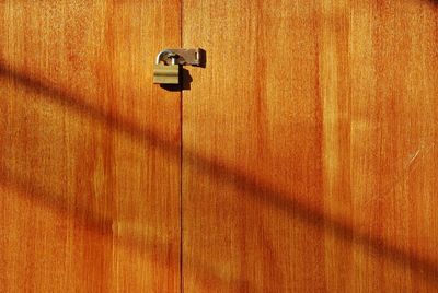 Close-up of lock on wooden door