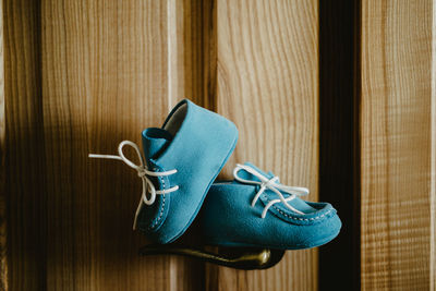 Close-up of shoes on wooden floor