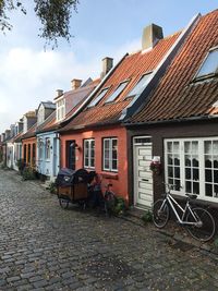 Houses against sky in city