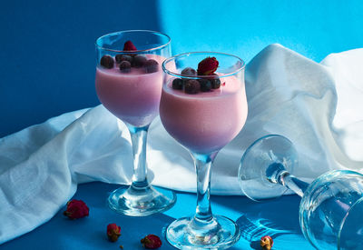 Close-up of glass of wine with drink on table