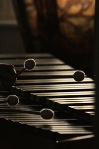 Cropped image of person hand playing marimba