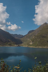 Scenic view of lake and mountains against sky