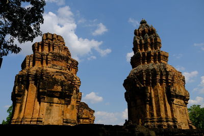 Low angle view of statue of temple against sky