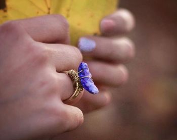 Close-up of woman hand holding flower