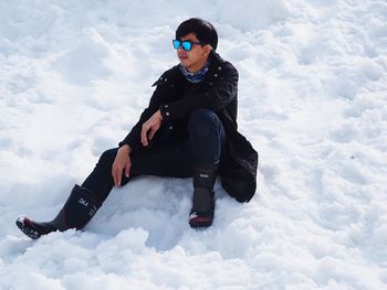 Man sitting on snow