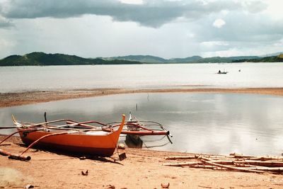 Scenic view of sea against cloudy sky